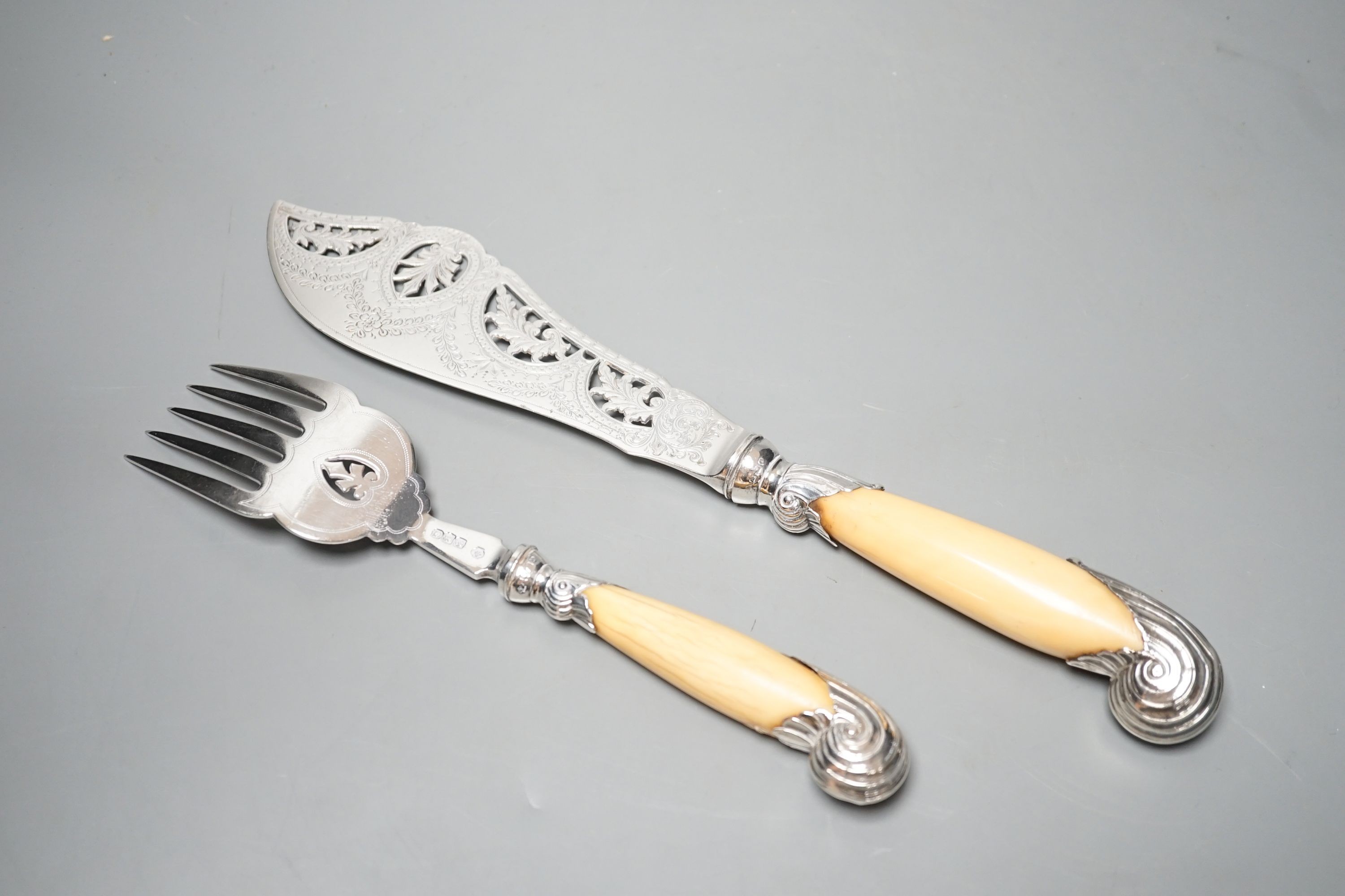 A pair of late Victorian ivory pistol handled silver fish servers, William Hutton & Sons, London, 1896, knife 33.2cm.